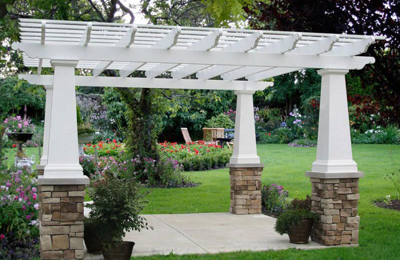 Fiberglass pergola with stone pedestals